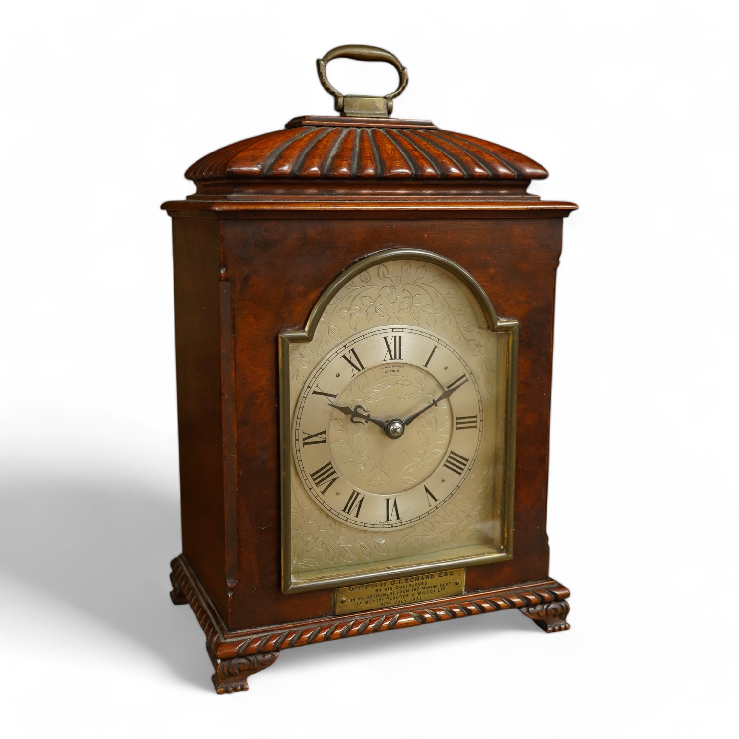 A mahogany mantel clock, retailed by J. W. Benson, c.1930, with engraved silvered dial, with key, 27cm high. Condition - good, untested